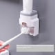 Dispenser, toothpaste dispenser with holder for two toothbrushes, gray frame